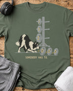 Somebody Has To T-Shirt — Military Green